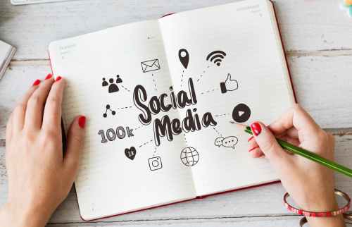 person writing on notebook